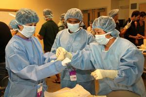 UH Manoa medical students in surgical gowns