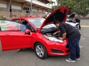 Honolulu CC AMT students bugging the vehicles the day before the competition. 