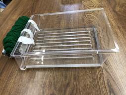 <p>Fig. 3.&nbsp; Plastic tray with paper strips taped to the "windward" side.</p>